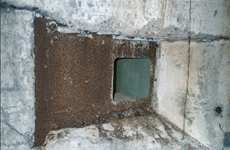 Armoured plate with embrasure for HMG near entry of shelter B1-1
